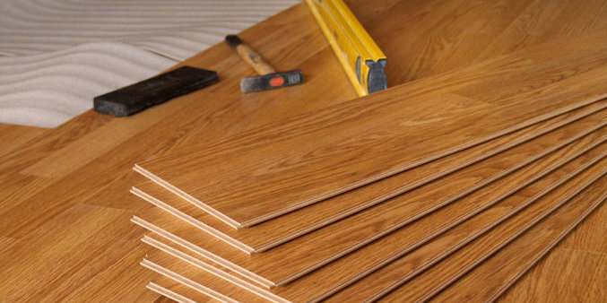 fake wooden floor panels and tools